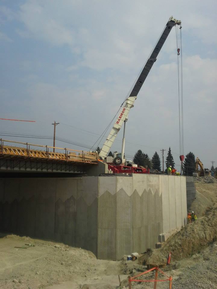 precast walls being installed on an overpass