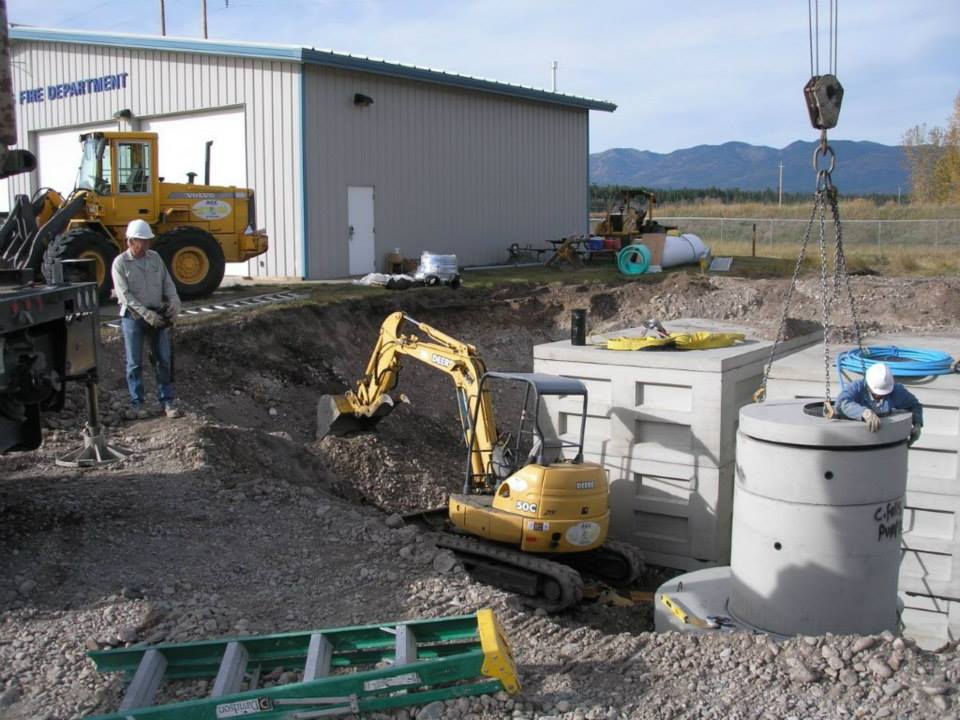 Glacier precast concrete fire refill site with excavator