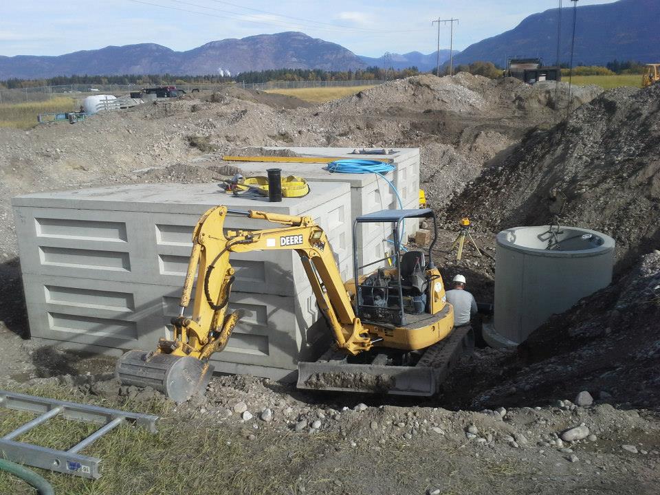 Glacier precast concrete fire refill site with excavator
