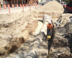 concrete Storm Drain jobsite with worker working