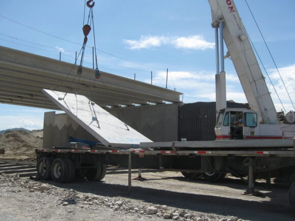 precast concrete panel being lifted by crane