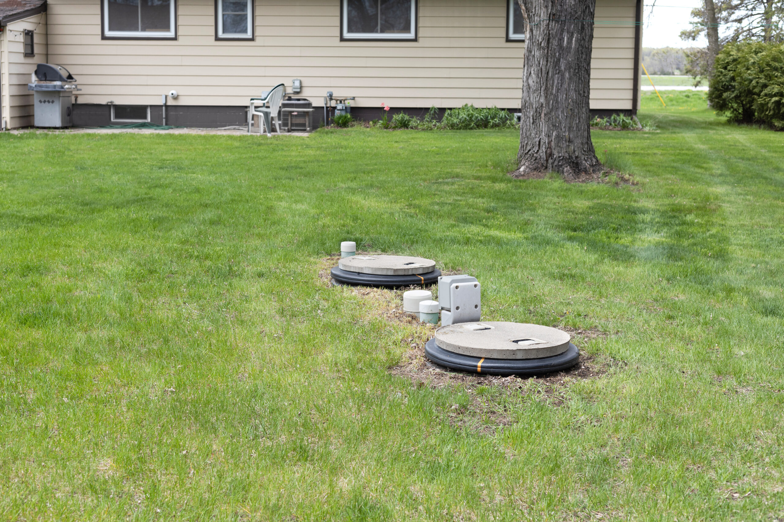 Septic system installed in the yard. Two chamber septic tank installed in the backyard